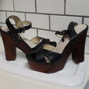 Black leather strappy wood clogs